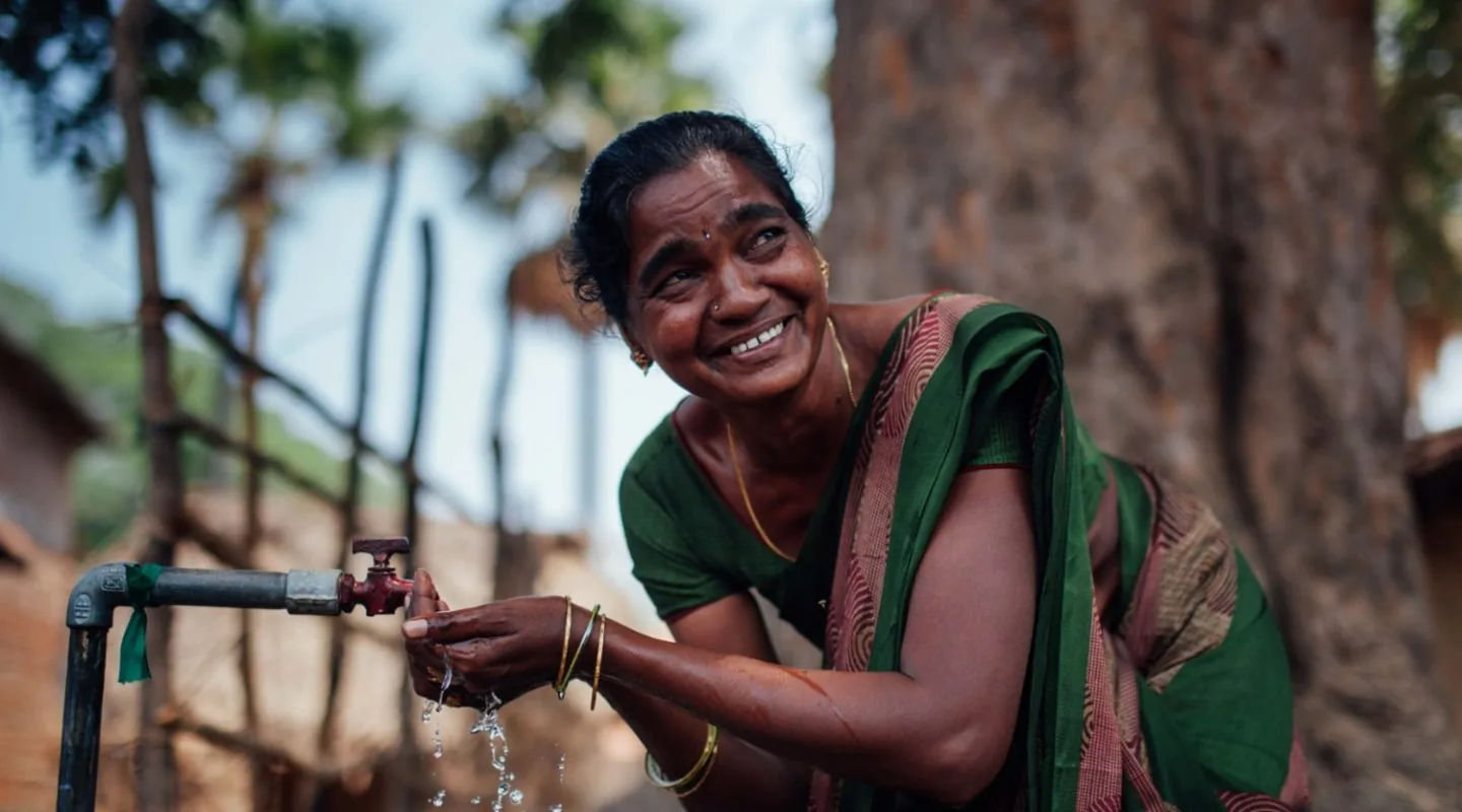 Photograph of an Indian woman drinking water