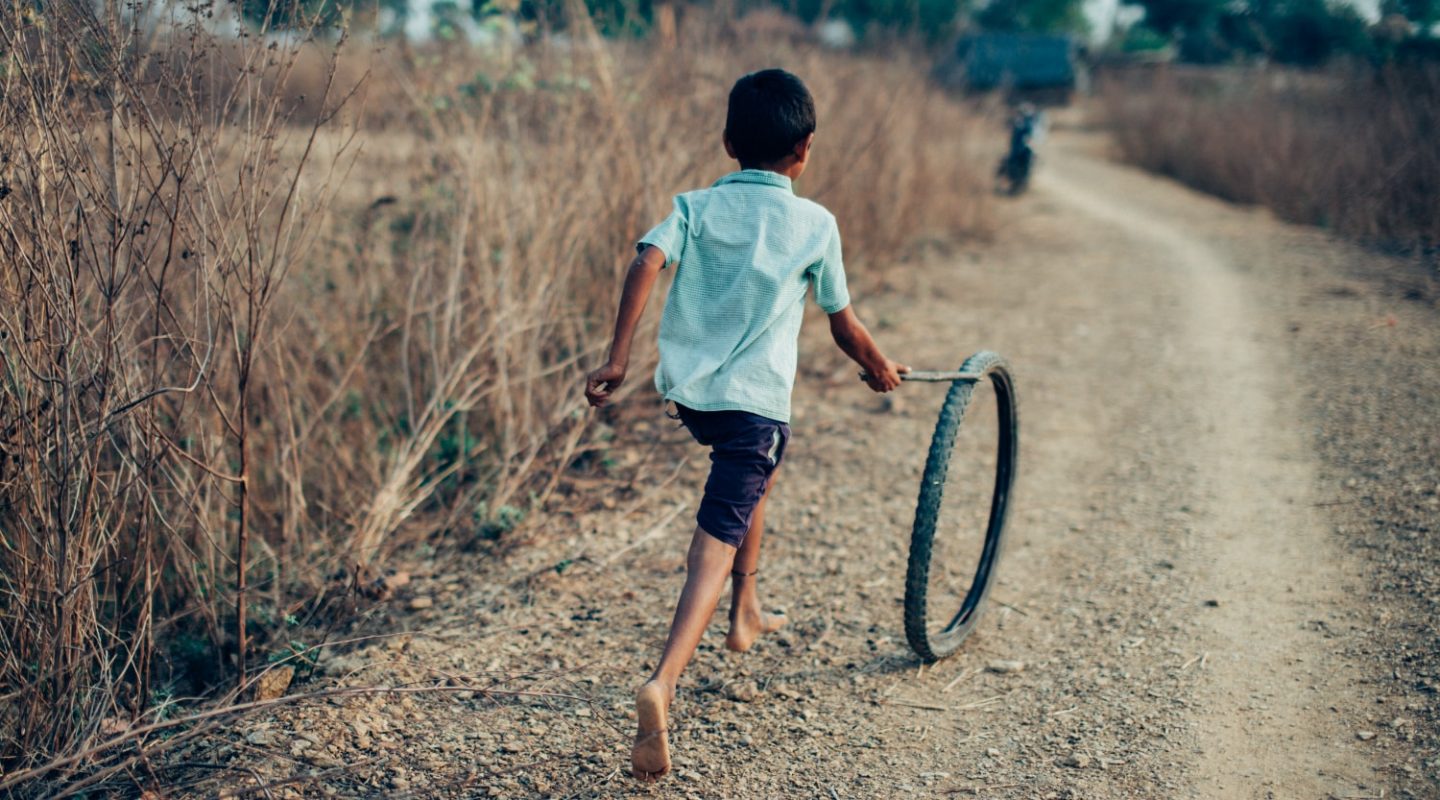 Indian child pushing trye for a campaign photography project