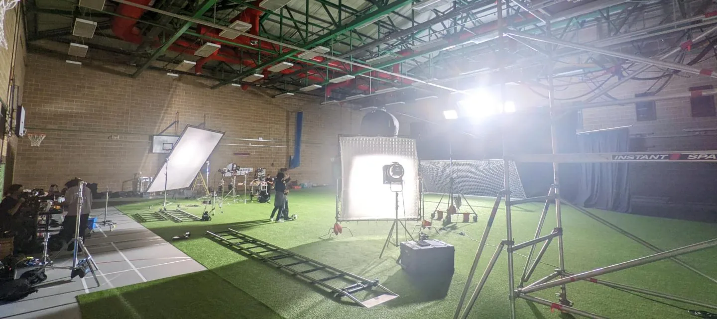 A studio football pitch lit for the Blue Lock TV advert shoot