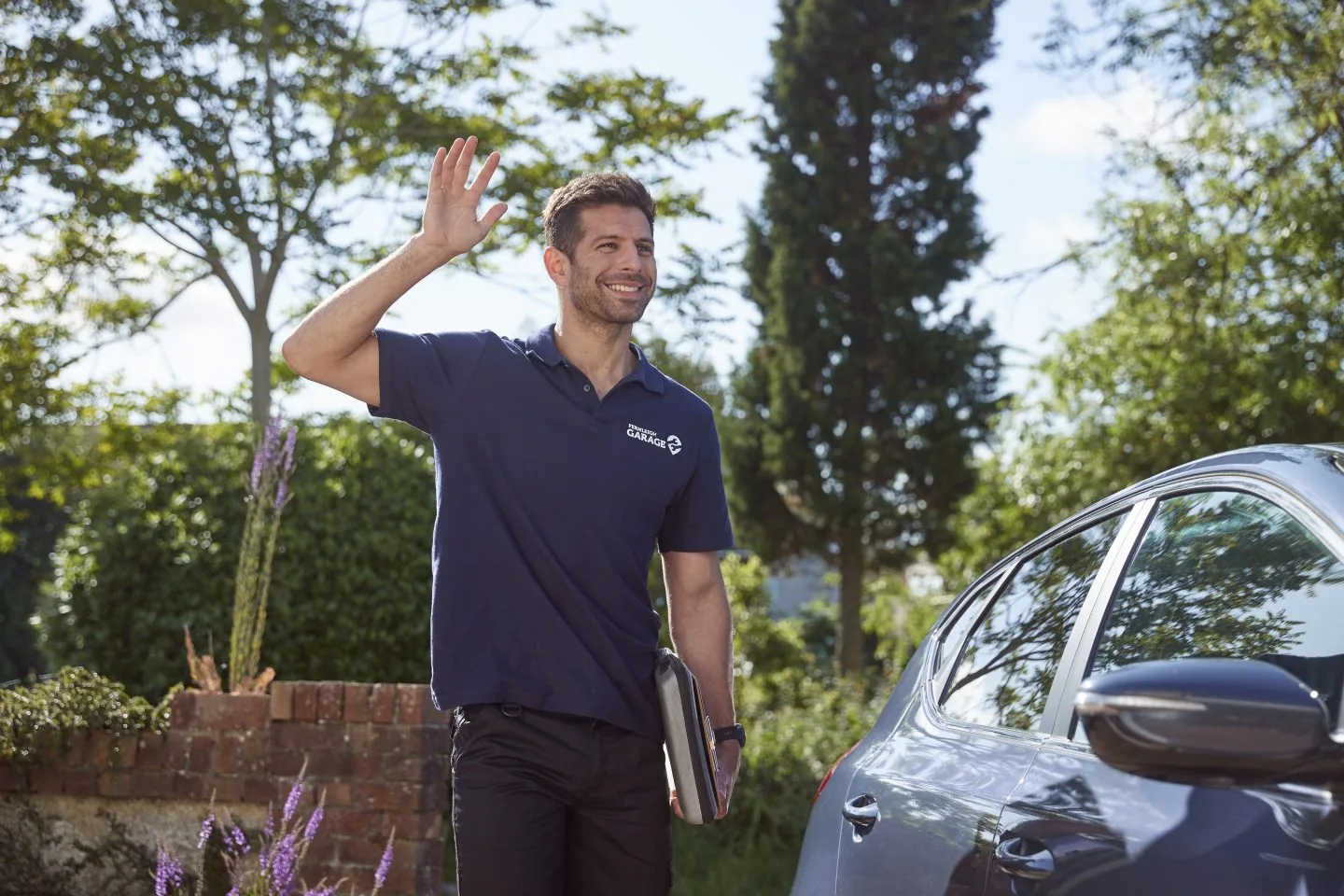 FixMyCar mechanic waving
