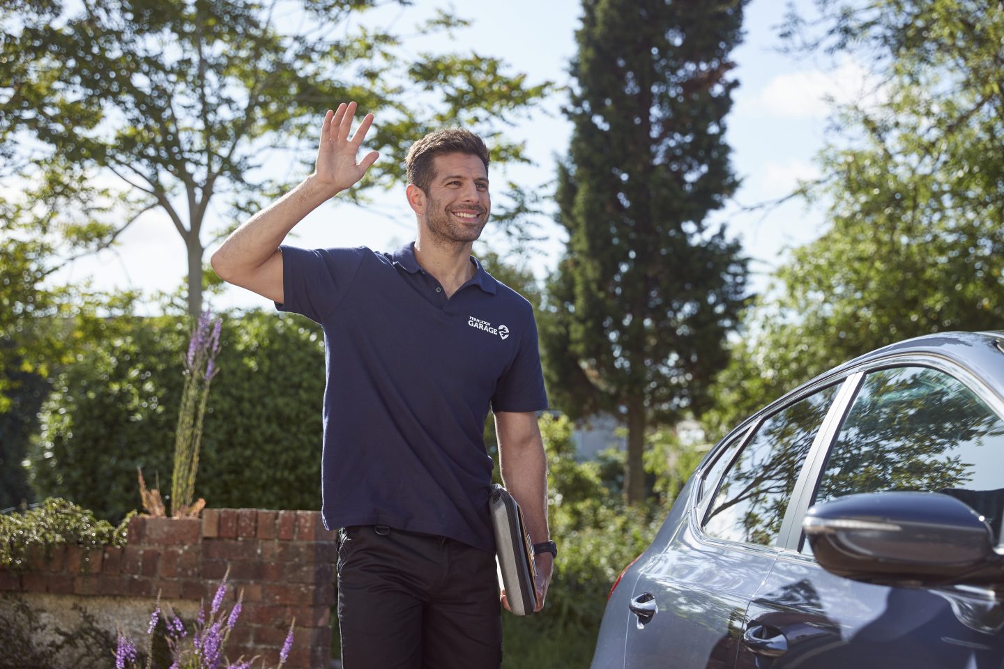 FixMyCar mechanic waving